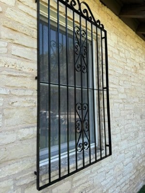 Custom iron fence & gate on stone wall